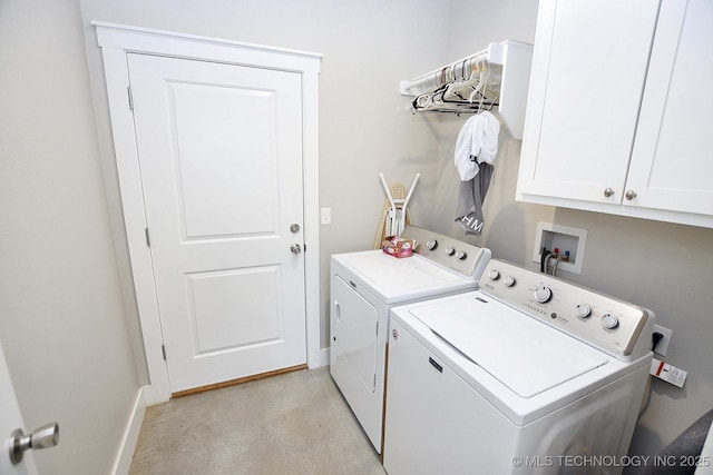 washroom featuring baseboards, cabinet space, and independent washer and dryer