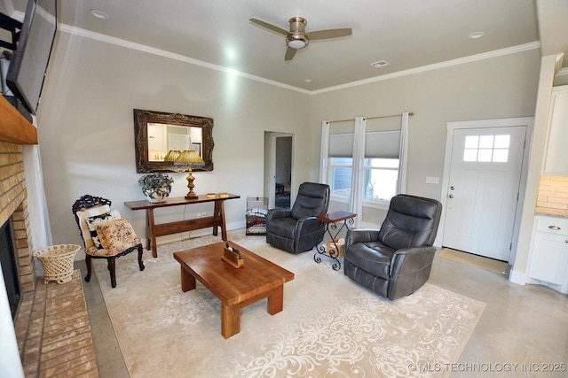 living room featuring visible vents, ceiling fan, a fireplace, and crown molding