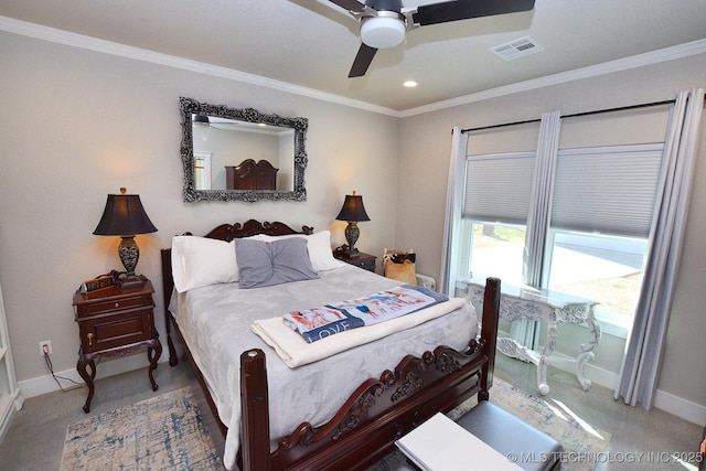 carpeted bedroom with visible vents, baseboards, and ornamental molding