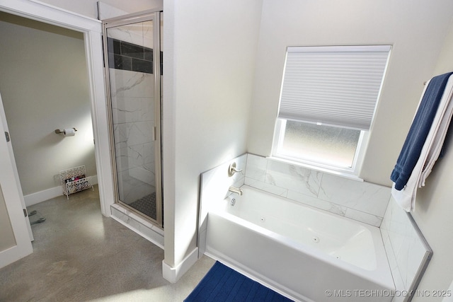 full bathroom featuring baseboards, a tub with jets, and a stall shower