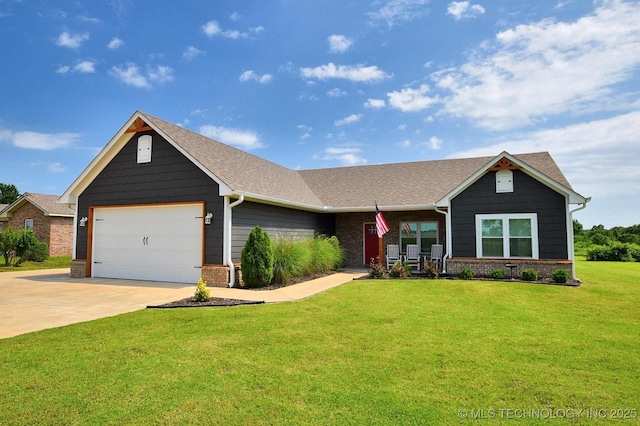 216 E Willis Rd, Tahlequah, OK 74464 - view of front of house featuring a front yard, brick siding, concrete driveway, and a garage