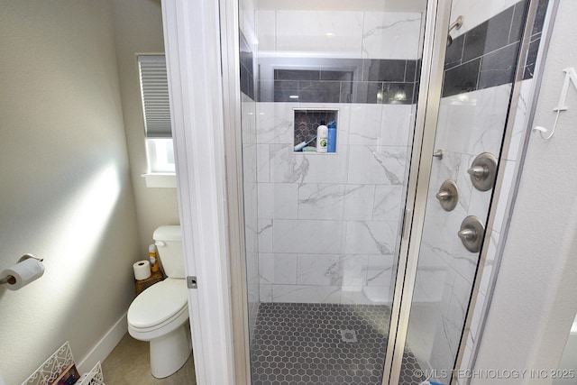 216 E Willis Rd, Tahlequah, OK 74464 - bathroom featuring toilet, a shower stall, and baseboards