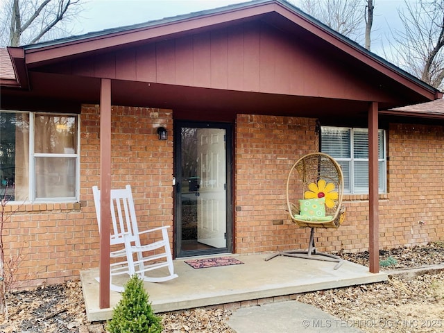 property entrance with brick siding