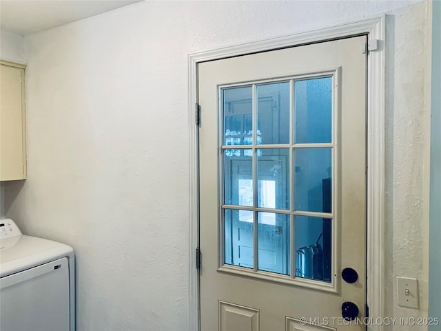 laundry area featuring cabinet space and washer / clothes dryer