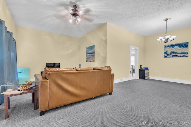 carpeted living area featuring a textured ceiling, baseboards, and a chandelier