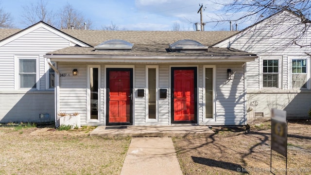 bungalow with crawl space, a porch, and roof with shingles