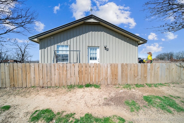 view of home's exterior featuring fence