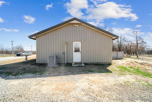 view of outdoor structure featuring an outbuilding and central AC