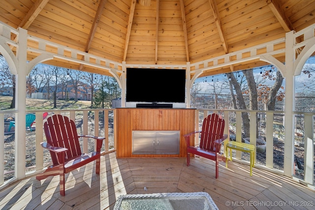 wooden deck featuring a gazebo