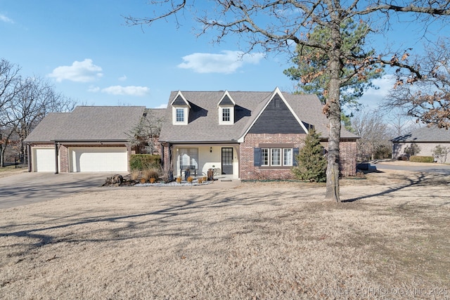 view of front facade with brick siding, concrete driveway, a garage, and a shingled roof