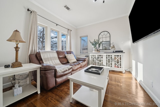 living area with visible vents, baseboards, dark wood-style flooring, and crown molding