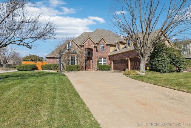 french country home with a garage, a front lawn, concrete driveway, and brick siding