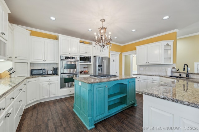 kitchen featuring open shelves, appliances with stainless steel finishes, white cabinets, and a sink