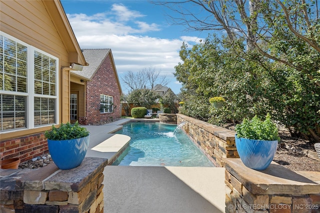 pool featuring a patio and fence