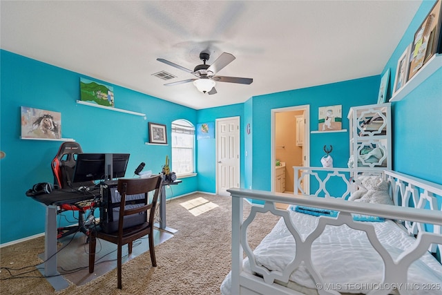 home office featuring visible vents, carpet flooring, baseboards, and ceiling fan