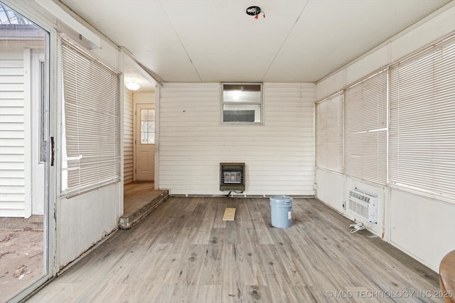 interior space featuring cooling unit and wood finished floors