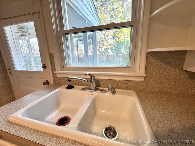 room details with light countertops and a sink