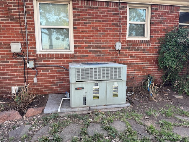 details with cooling unit and brick siding