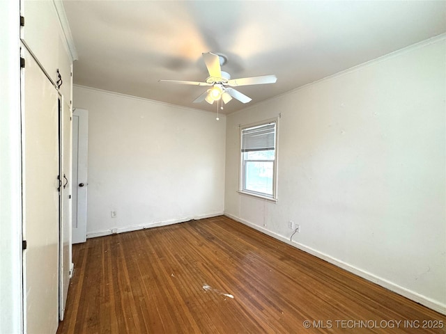 unfurnished bedroom with baseboards, a ceiling fan, wood finished floors, and crown molding