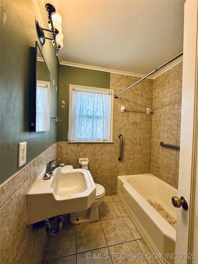 full bath with tile walls, tile patterned flooring, crown molding, and plenty of natural light