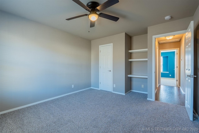 unfurnished bedroom featuring carpet, baseboards, and ceiling fan