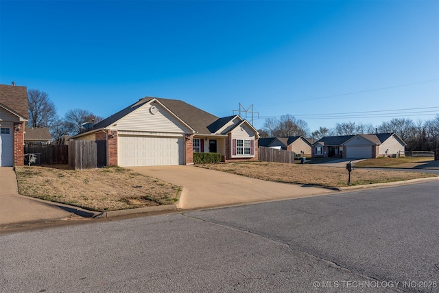 ranch-style home with brick siding, concrete driveway, an attached garage, and fence