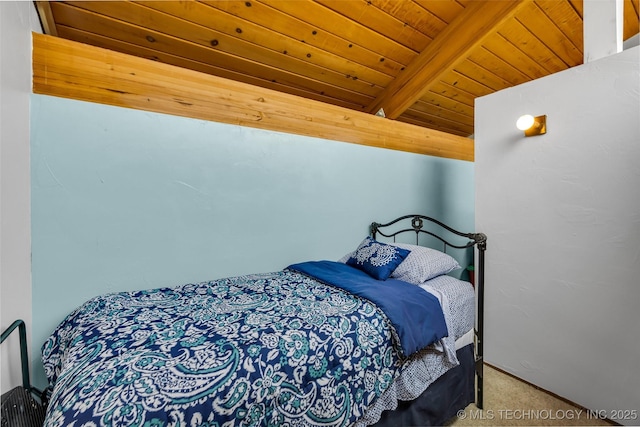 bedroom featuring carpet flooring, wood ceiling, and lofted ceiling with beams