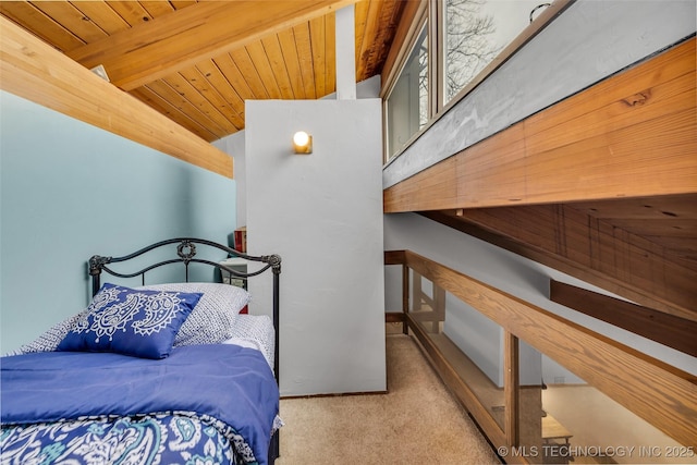 carpeted bedroom with wooden ceiling and vaulted ceiling with beams