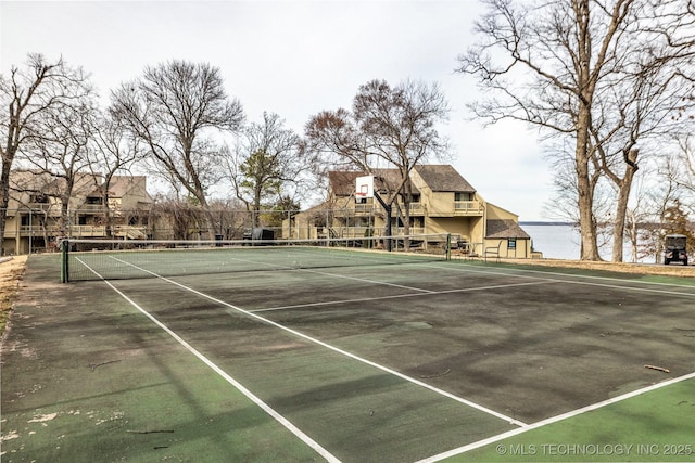 view of tennis court with fence