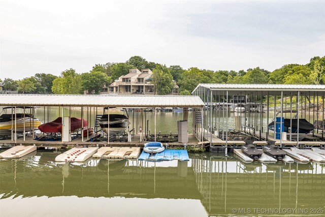 dock area featuring a water view and boat lift