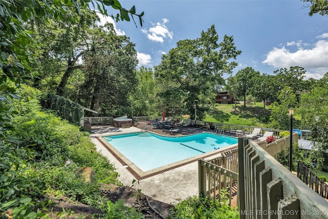 community pool with a patio area