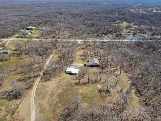 aerial view featuring a view of trees