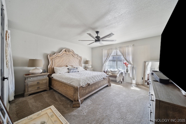 bedroom featuring ceiling fan, a textured ceiling, and carpet