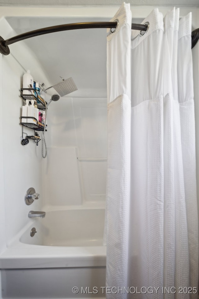 bathroom with shower / bathtub combination with curtain