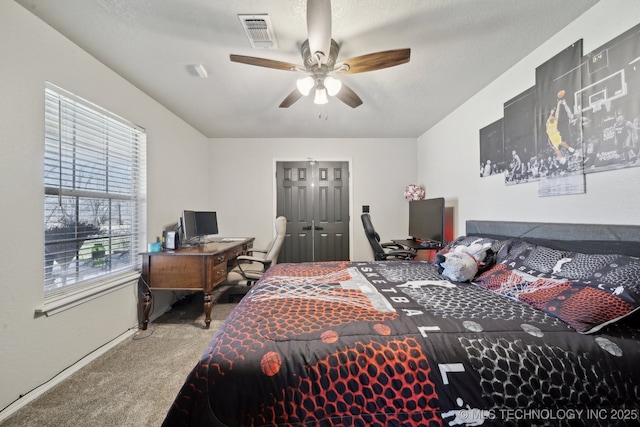 bedroom featuring visible vents, carpet floors, and ceiling fan