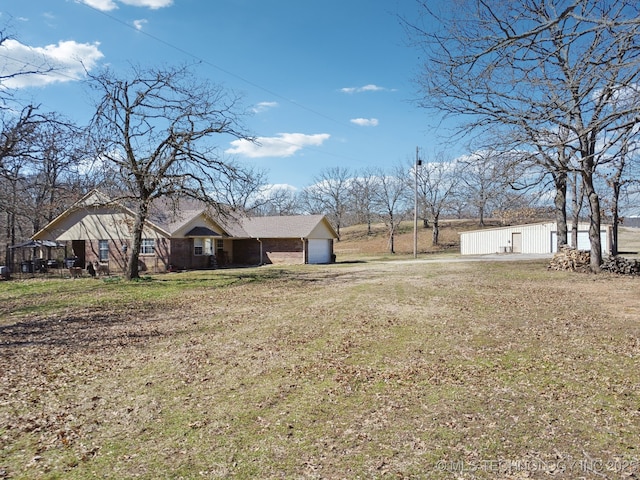 view of yard featuring an attached garage