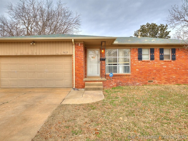 single story home featuring a front lawn, concrete driveway, an attached garage, crawl space, and brick siding