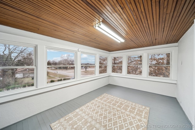 unfurnished sunroom with wooden ceiling