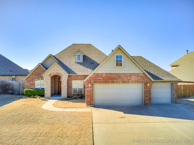 traditional home with brick siding, driveway, and a shingled roof