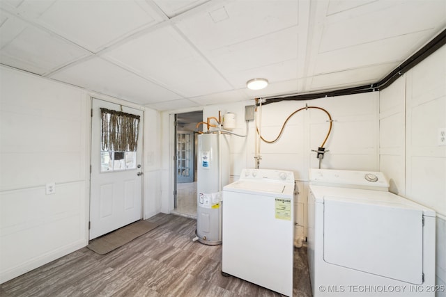 laundry room with electric water heater, wood finished floors, laundry area, and washer and clothes dryer