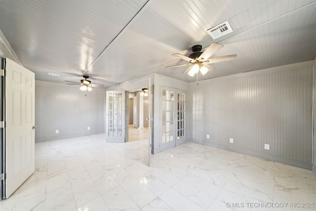 spare room featuring visible vents, marble finish floor, french doors, baseboards, and ceiling fan