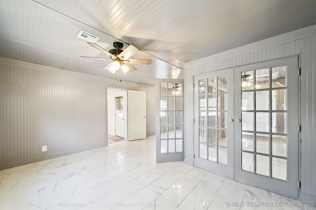 unfurnished room featuring a ceiling fan, french doors, visible vents, and marble finish floor