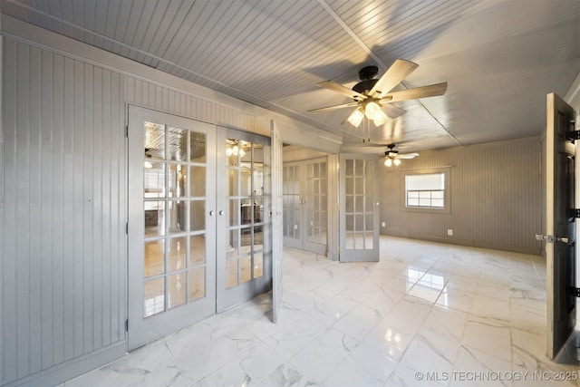 unfurnished sunroom with french doors