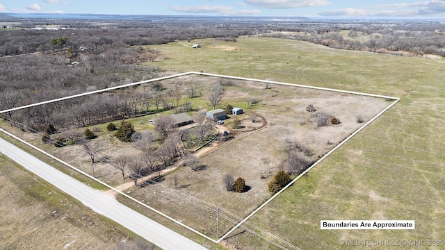 birds eye view of property with a rural view