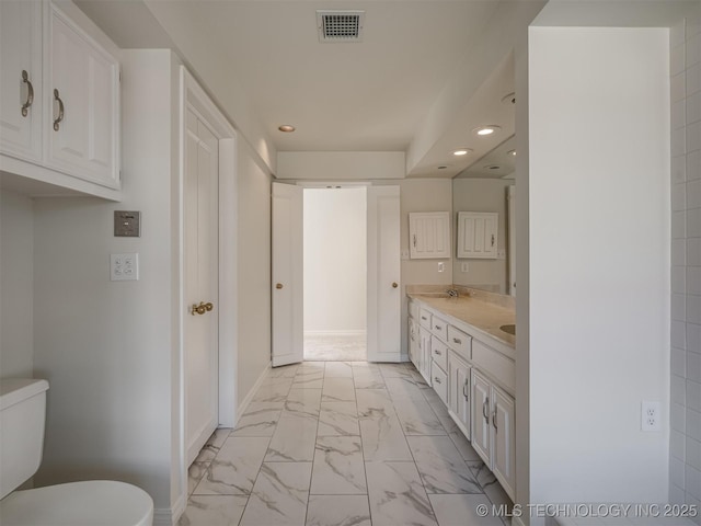 bathroom featuring visible vents, baseboards, recessed lighting, toilet, and marble finish floor