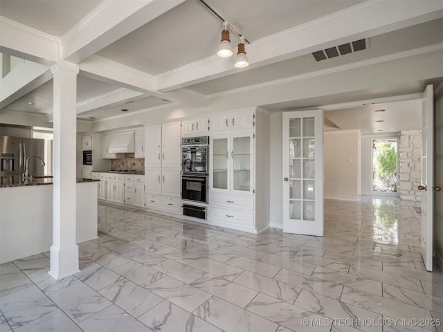 kitchen featuring visible vents, marble finish floor, custom range hood, dark countertops, and stainless steel fridge with ice dispenser