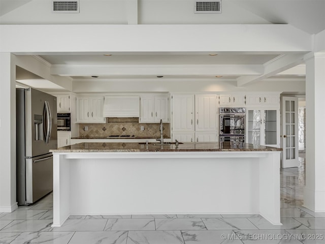 kitchen with visible vents, marble finish floor, stainless steel refrigerator with ice dispenser, and a sink