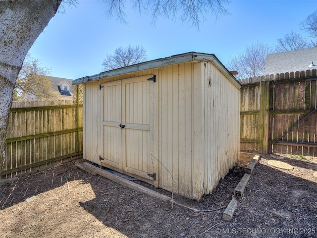 view of shed featuring a fenced backyard