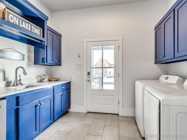 laundry area with separate washer and dryer, cabinet space, baseboards, and a sink