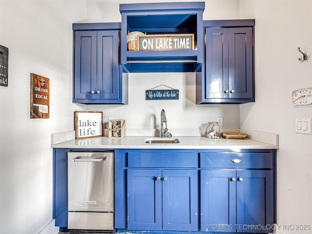 kitchen featuring a sink, blue cabinets, stainless steel dishwasher, and light countertops